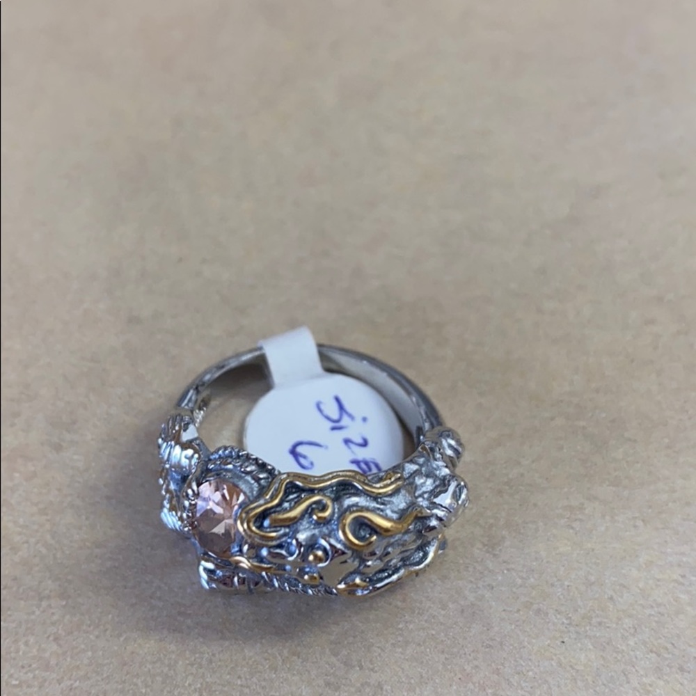 Size 6 dragon ring holding a Crystal. Brand new